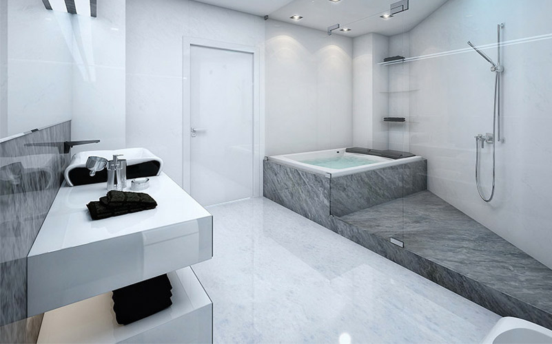 Baño con tina y muros revestidos en piedra gris